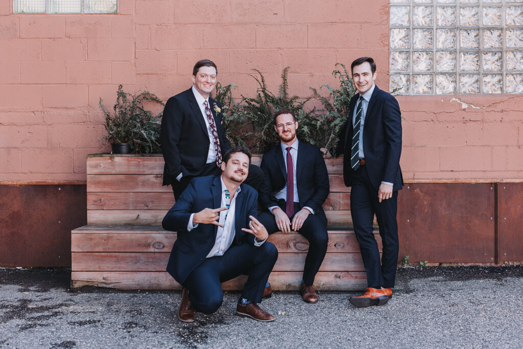 Sustainable wedding tip: Tell your guests about sustainability. Photo shows groomsmen.
