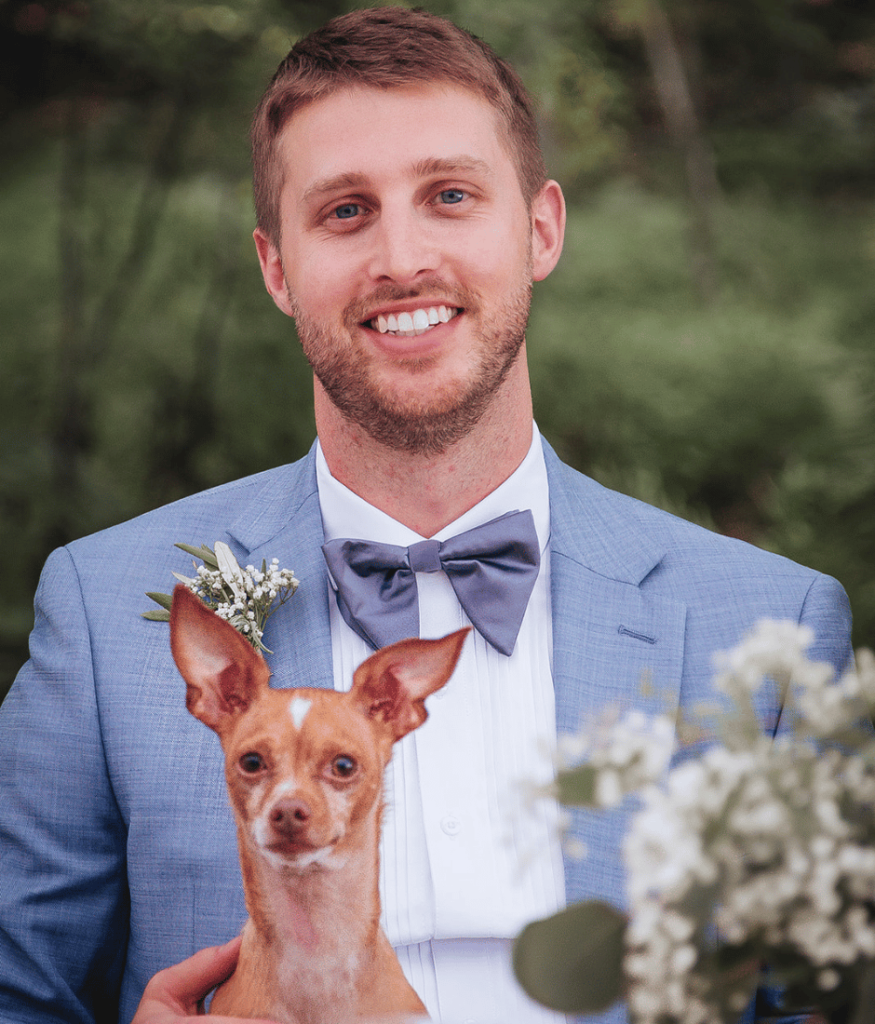 Image of groom holding his small brown dog. This shows how to plan elopement with persoanlized details such as having a pet with you. 