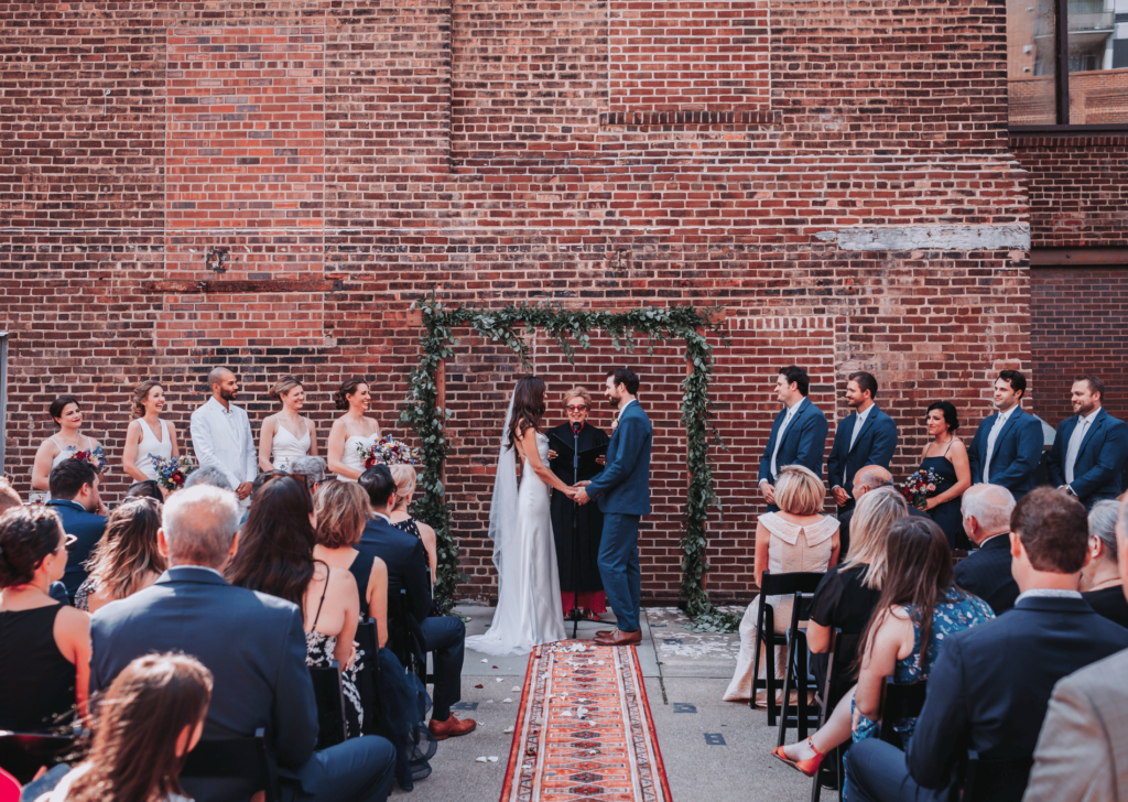 Image of a couple getting married at Aster Cafe as one of our top Minneapolis Wedding Venues! 