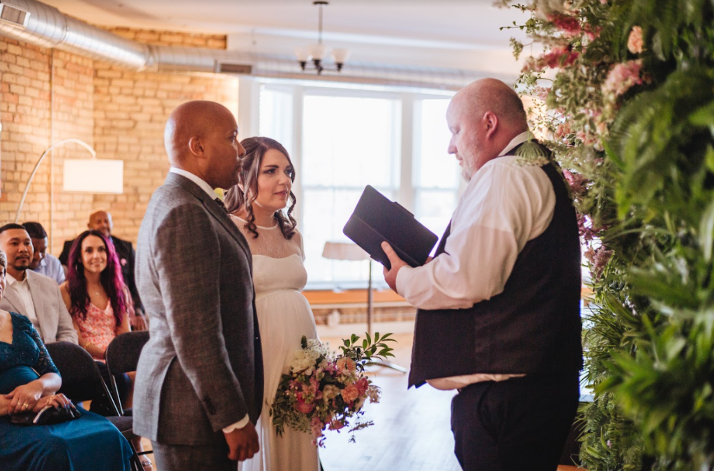 Image of a couple getting married at The APT one of our favourite Minneapolis Wedding Venues. 