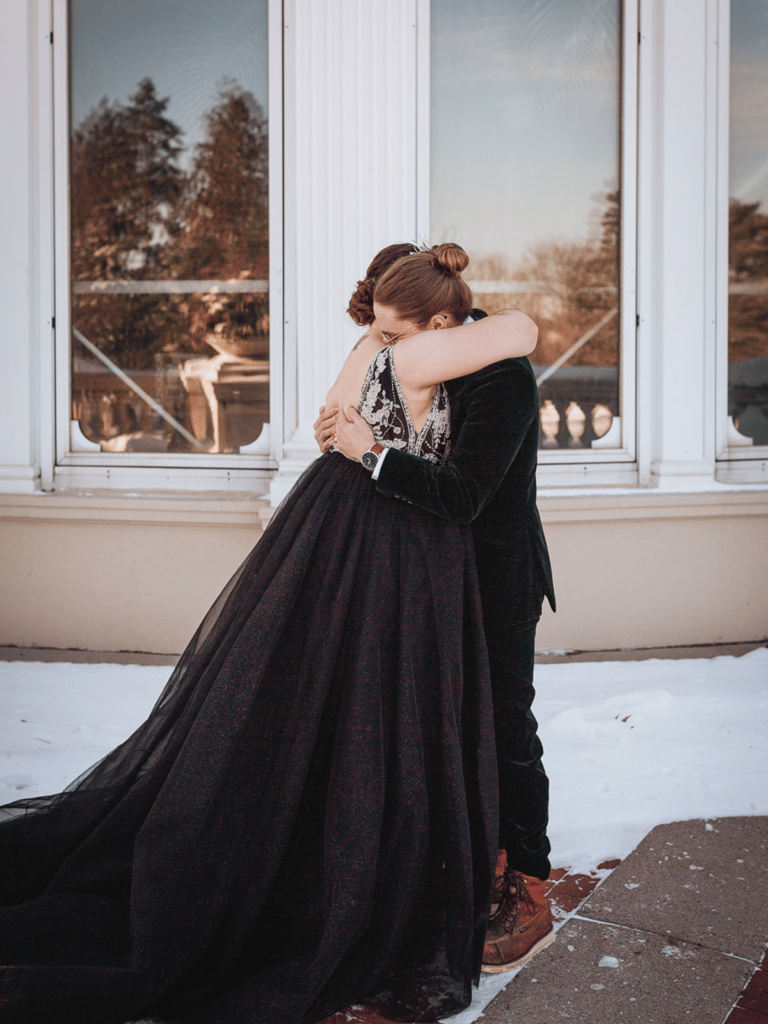 Image of a bride and groom embrace. 