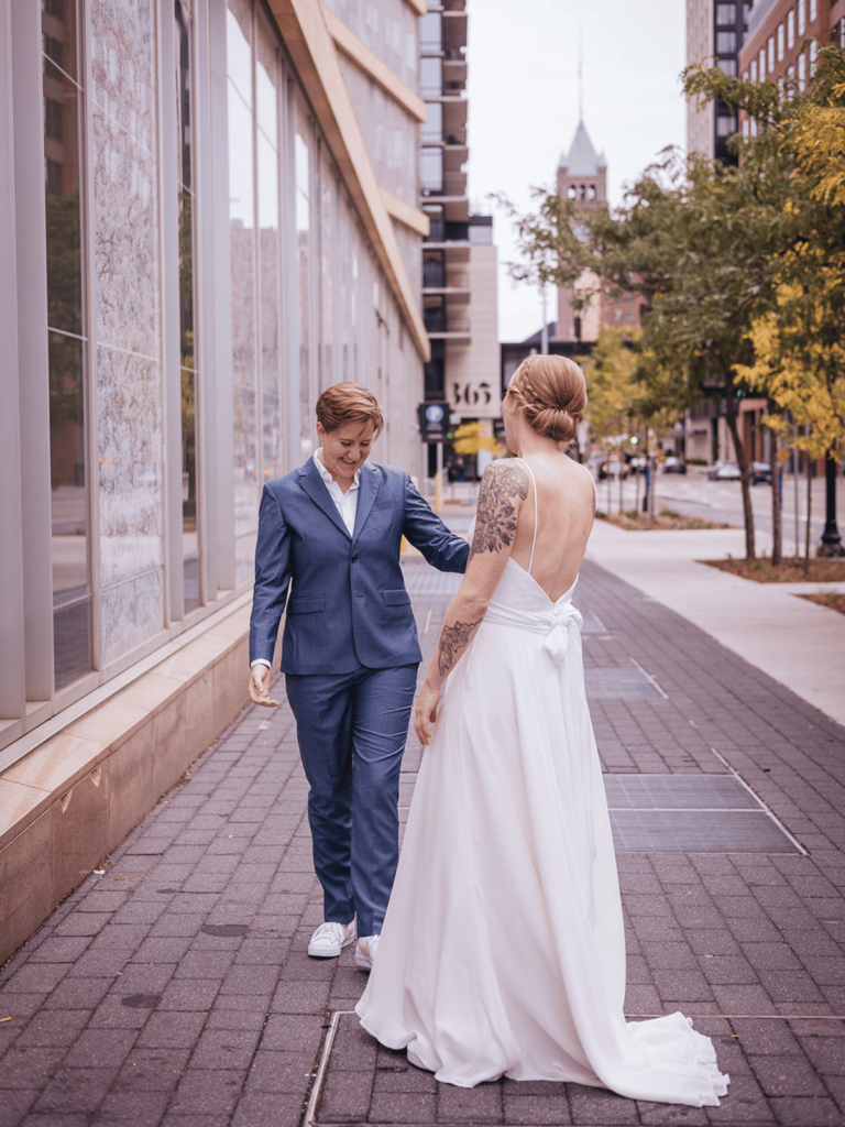 Image of a couple seeing each other for a wedding look, showing how cute a wedding first look can be and what is a first look at a wedding! 