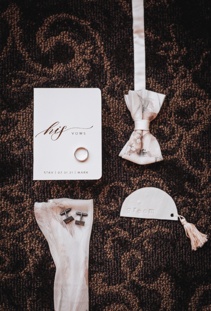 Image of detailed groom items such as his vows, bow-tie, cuff link and wedding ring for getting ready photos wedding.