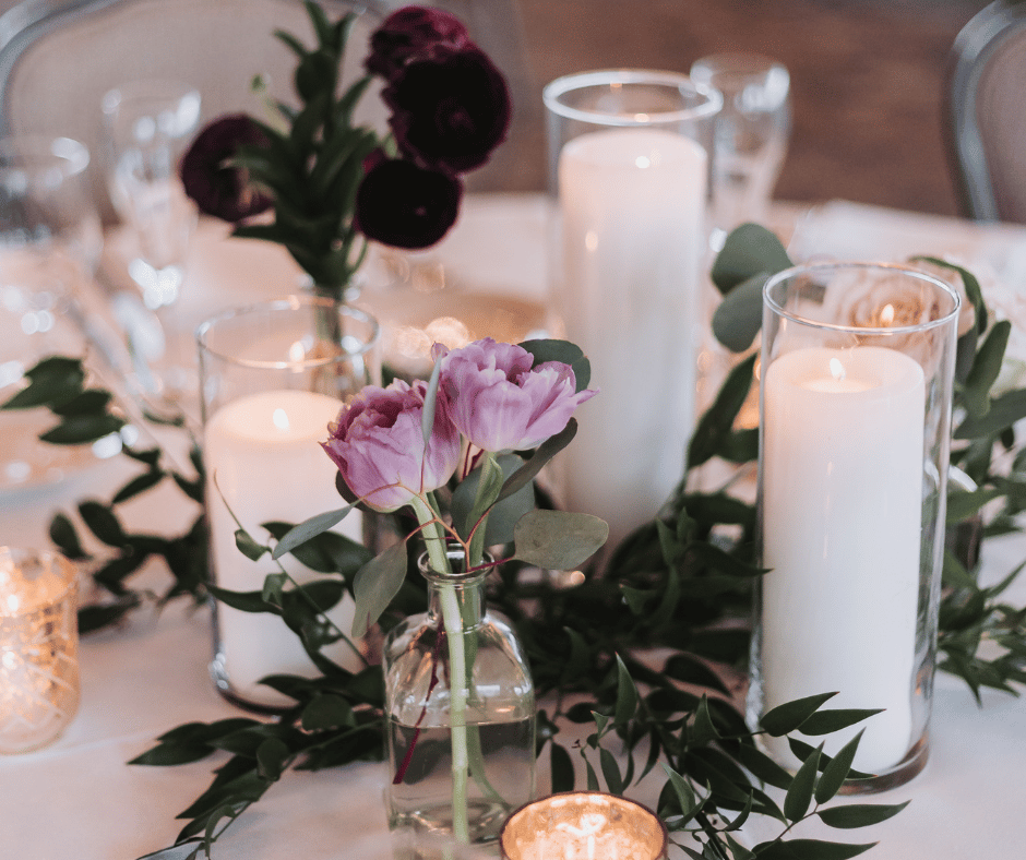 Image of flowers and candles for decor at wedding. What to look for in a wedding planner.