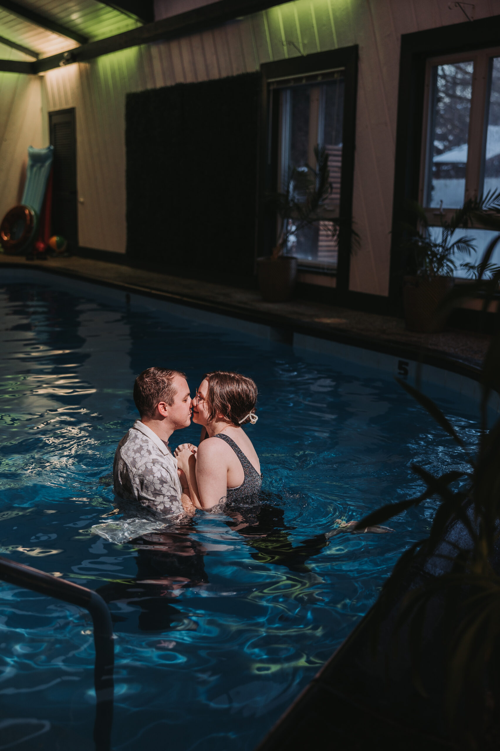 fun engagement session at a pool