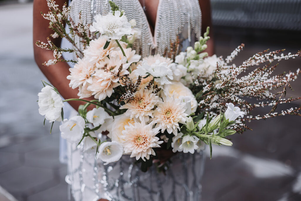 A gorgeous white and blush wedding flower bouquet from St. Paul's Ergo Floral