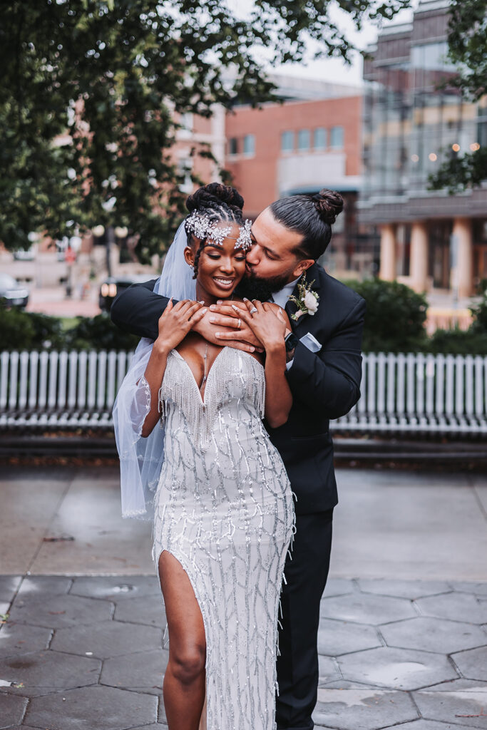 Outdoor micro wedding venue in St. Paul - marrying couple stands in Rice Park