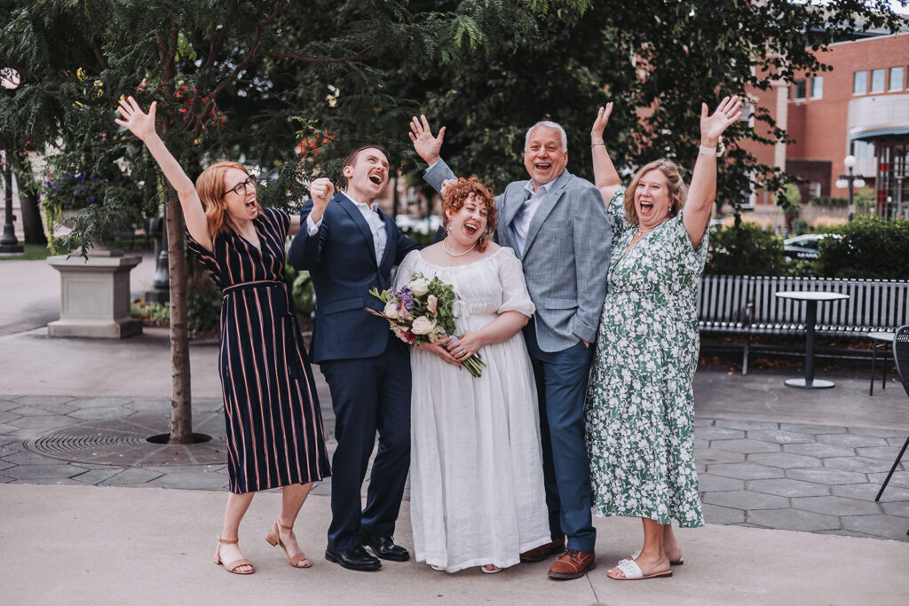 The St. Paul Hotel is a great micro wedding venue - bride and family pose outside